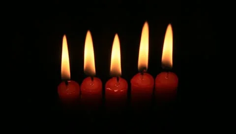 Five red candles lighting up the night Stock Footage 11022213