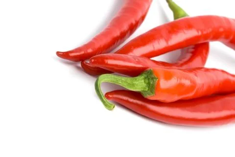 Five red chilli peppers Stock Photos