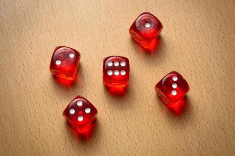 Five red dice on the table. Concept of luck, game, gamble, fortune Stock Photos