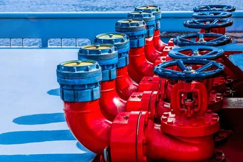 Five red fire hydrants on a fire line on a ship. Stock Photos
