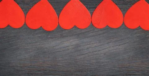 Five red hearts on background Stock Photos