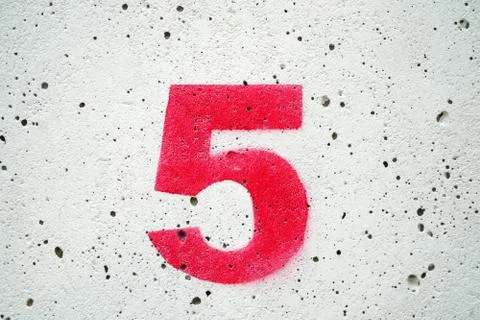 Five red numbers on old concrete and white backgrounds. Stock Photos
