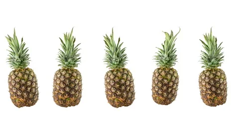 Five ripe fresh pineapples on white background Stock Footage 157117173