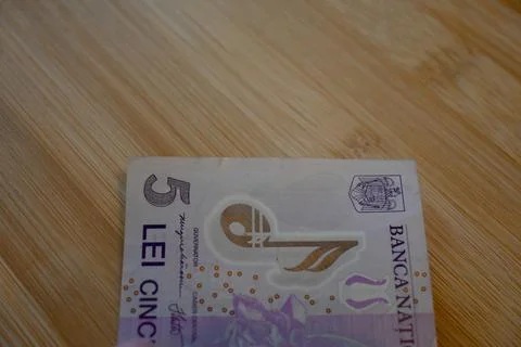 Five Romanian Leu Banknotes on Table, Cost of Living Financial Concept Fotos Stock