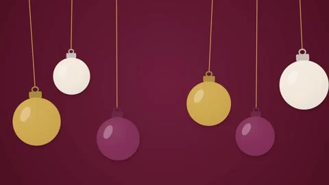Five round ornaments hang from strings against a burgundy background. The Vidéo 348341650