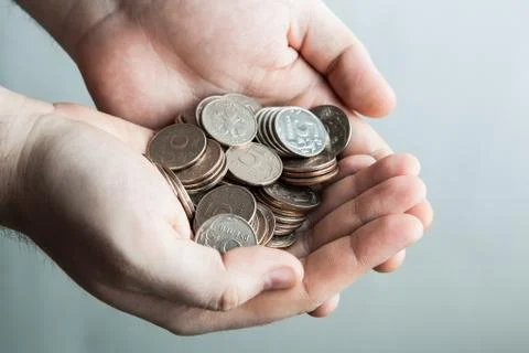 Five-ruble coin in man's hands Stock Photos