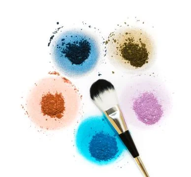 Five samples of bright dry pigment in the form of a flower with a brush. Stock Photos