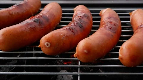 Five sausages grilling Stock Footage 276106320