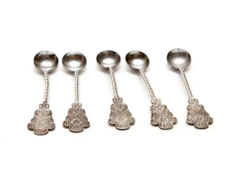 Five silver spoons Stock Photos