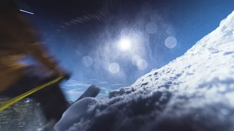 Five skiiers jump past the camera and get snow all over the nice clean lens Stock Footage 79464941