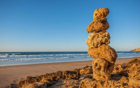 Five small rocks placed atop each other Stock Photos