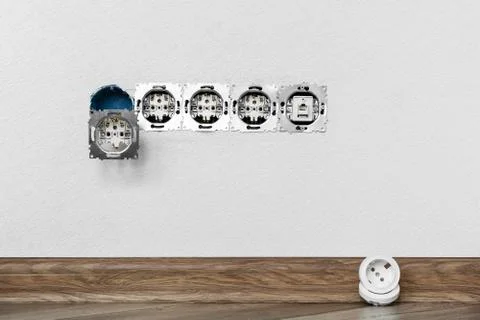 Five sockets installed in the white wall Foto stock