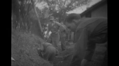 Five soldiers digging a pit Stock Footage