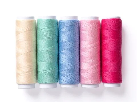 Five spools of multi colored polyester sewing thread, photo Stock Photos