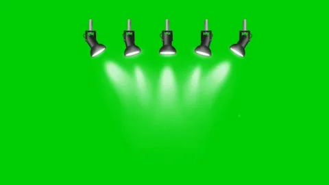 Five Spotlights Beaming Bright Lights on Green Screen Background. Stockbeeldmateriaal 332552069