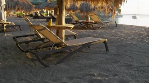 Five Star Beach Resort with bamboo straw huts and lounge chairs. Stock-Footage 308722579