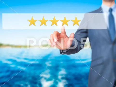 Five star rating - Businessman hand pressing button on touch scr Stock Photos