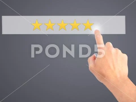 Five star rating - Hand pressing a button on blurred background Stock Photos