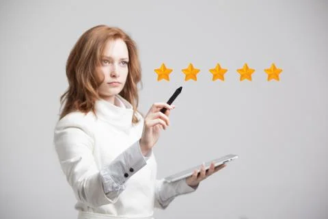 Five star rating or ranking, benchmarking concept. Woman assesses service, hotel Stock Photos