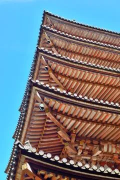 Five-storied pagoda roofs and blue sky at Daigoji temple, Kyoto, Japan. Stock Photos