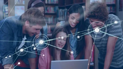 Five students around laptop library seated student typing and growing node web Video stock 330194688