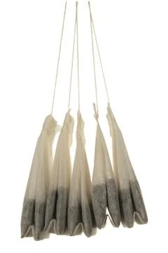 Five tea bags close-up isolated on white background Foto stock