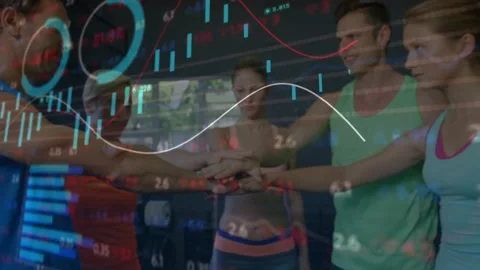 Five teammates forming hand stack in gym, lifting arms overhead celebrating as Stock Footage 330563530