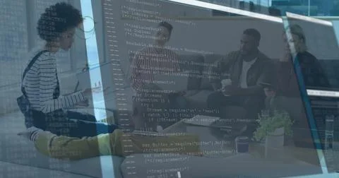 Five tech professionals discussing ideas in office lounge, with cups on table Foto stock