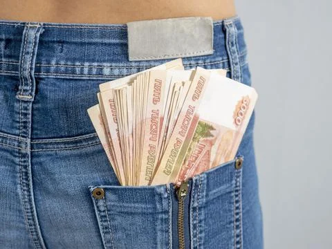 Five thousand Russian rubles banknotes in the back pocket of his jeans. The c Stock Photos