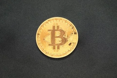 Five Virtual Coins Bitcoins On Printed Circuit Board Stock Photos