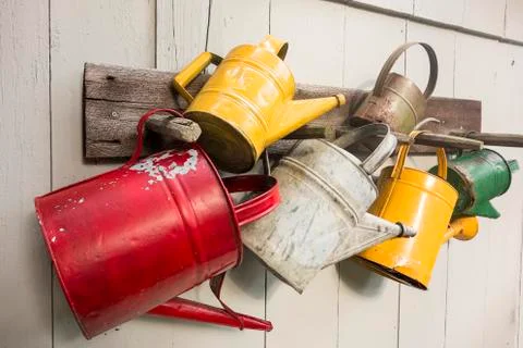 Five watering cans Stock Photos