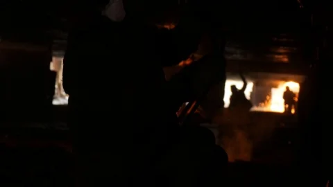 Five welders in a dry dock under a ship, cutting metal Stock Footage 87505387