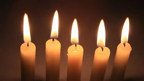 Five white candles on black Stock Footage 11022364
