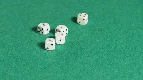 Five white dices rolling in slow motion on a green mat Stock Footage 161955436