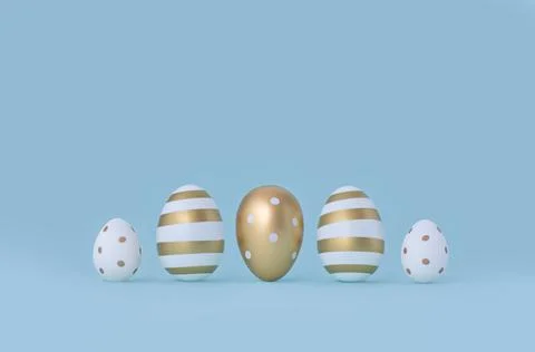 Five White with gold Easter eggs on a blue background with copy space. Stock Photos