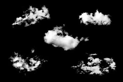 Five white natural clouds isolated on a black background. Stock Photos