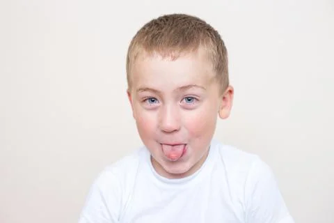Five year old boy with a funny facial expression Stock Photos