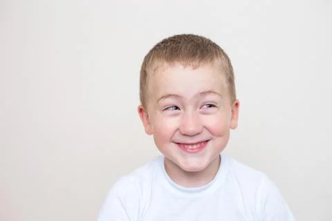 Five year old boy with a funny facial expression Stock Photos