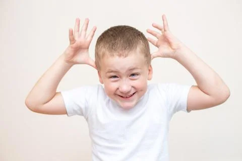 Five year old boy with a funny facial expression Stock Photos