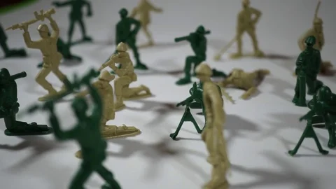 Five year old boy playing with toy soldiers Stock-Footage 82489438