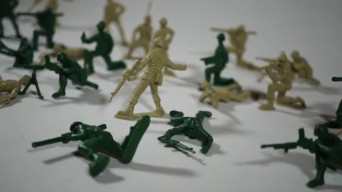 Five year old boy playing with toy soldiers Stock Footage 82489485
