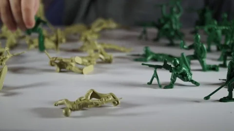 Five year old boy playing with toy soldiers Stock Footage 82489544