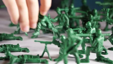 Five year old boy playing with toy soldiers Stock Footage 82489643
