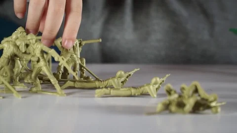 Five year old boy playing with toy soldiers Stock-Footage 82489820