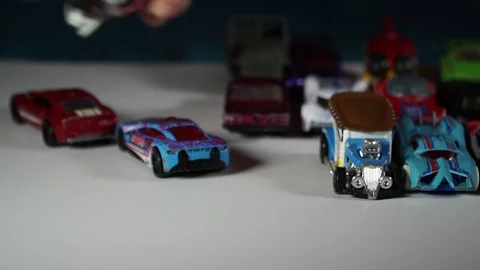 Five year old boy playing with toy cars Stock Footage 82490260