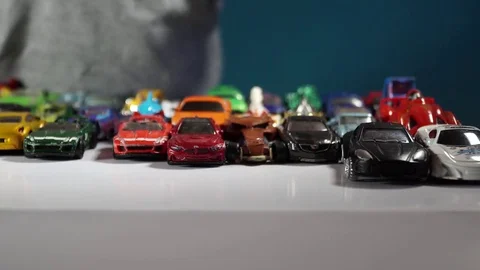 Five year old boy playing with toy cars Stock-Footage 82490313