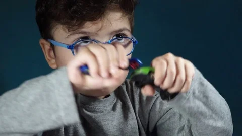 Five year old boy playing with toy cars Stock-Footage 82490386