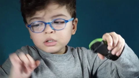 Five year old boy playing with toy cars Stock-Footage 82490432