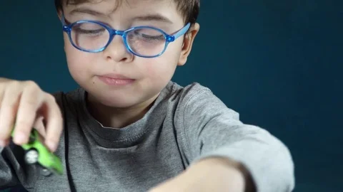 Five year old boy playing with toy cars Stock-Footage 82490489