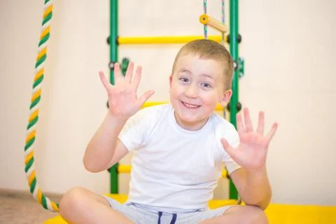 A five year old boy playing in his room Stock Photos
